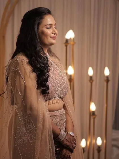 This candid shot highlights the intricate beadwork on the blouse and the soft, flowing tulle of the cape. It’s a beautiful example of the detailed craftsmanship available in my rental collection.