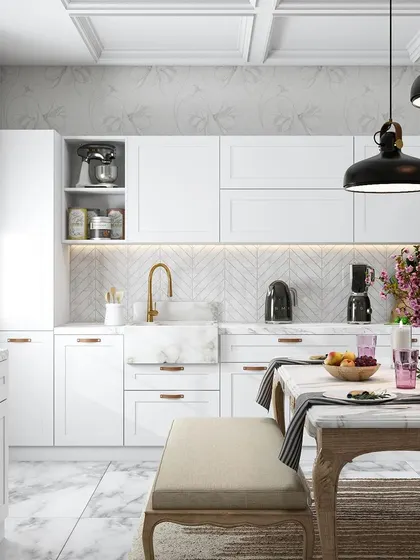 An elegant, all-white kitchen with a farmhouse sink, gold faucet, and a dining bench, creating a look inspired by "The Garden of Time" theme.