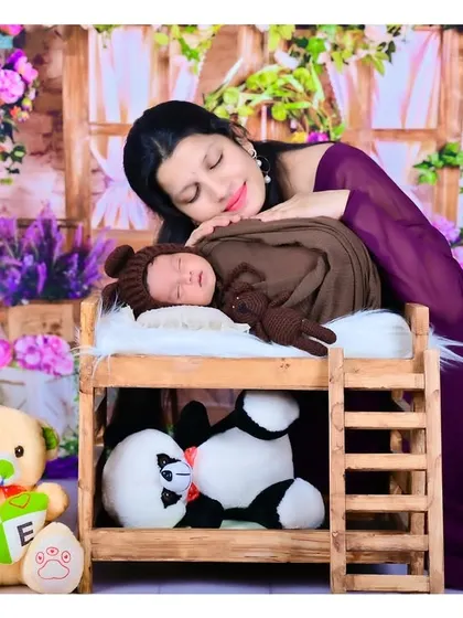Your journey with me doesn't have to end with pregnancy. This image is from a newborn session, where I create a safe and cozy environment to photograph your little one's first days. It's a precious way to continue telling your family's story.