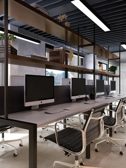 The open workstation area, designed for collaboration and focus. The layout features clean lines, ergonomic chairs, and overhead shelving for a functional and modern workspace.