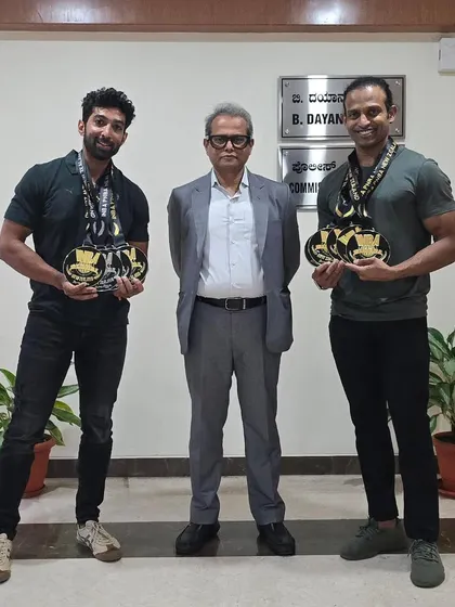 A formal photo with the Commissioner, showing him our medals from the world championship.