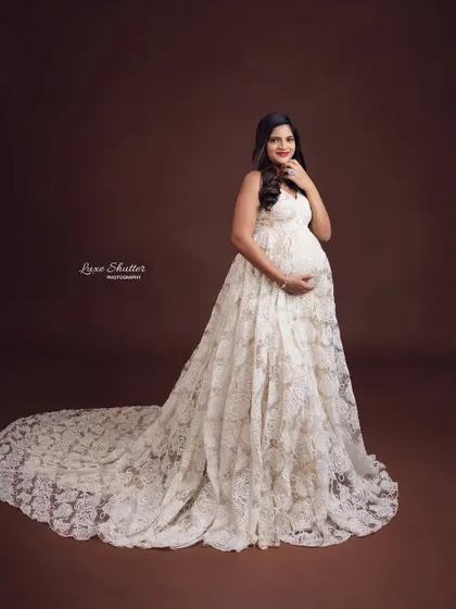 A full-length view of this exquisite lace gown, showing its long train and delicate details. A truly timeless choice.