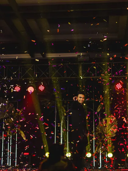 A shower of confetti marks the grand finale of the groom's spectacular solo performance.