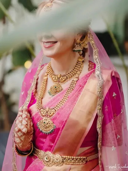 A duplicate of 189, this image again captures the bride's joyful expression and the beautiful details of her attire and henna.