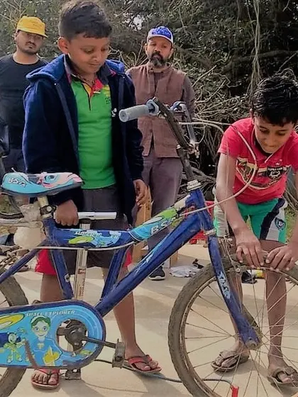 A young participant gets his hands dirty fixing his bike at our Hyderabad workshop. There's a special pride that comes from repairing your own things.