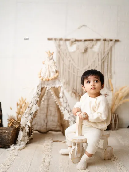 A thoughtful moment captured during our boho session. The neutral tones and natural textures keep the focus on this beautiful baby.