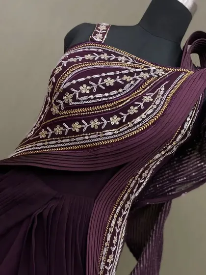 A detailed shot of the intricate embroidery on our draped saree gown, perfect for a modern ethnic look.