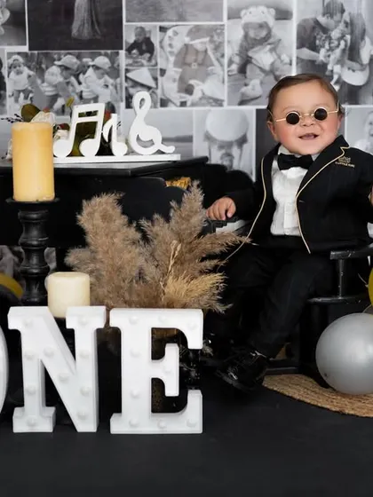 This little rockstar is turning one! We had a blast with this music-themed birthday shoot, complete with a mini piano, cool shades, and a whole lot of attitude.