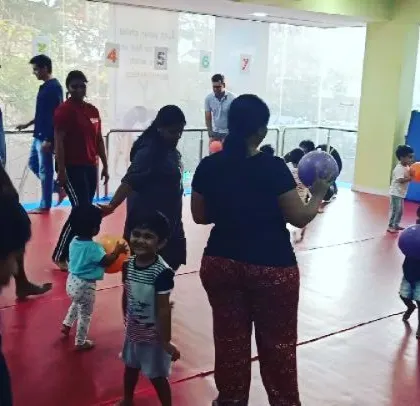 A collection of joyful moments from a Saturday evening "Super Beasts" class, featuring bubble time, group activities, and lots of smiles between parents and children.