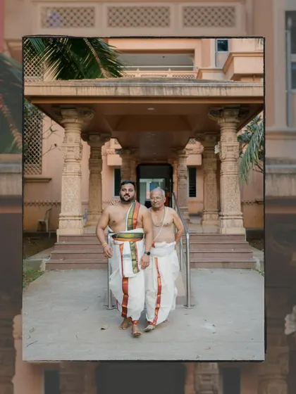 A powerful portrait of the groom in traditional South Indian attire walking with his father, a moment of generational connection.