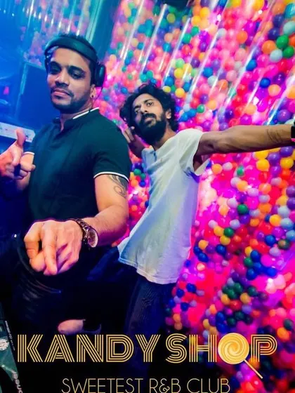 DJing during a 'Uni Edition' night at Kandy Shop. The colorful ball pit wall makes for a unique backdrop while I spin a mix of Bollywood and R&B for the student crowd.