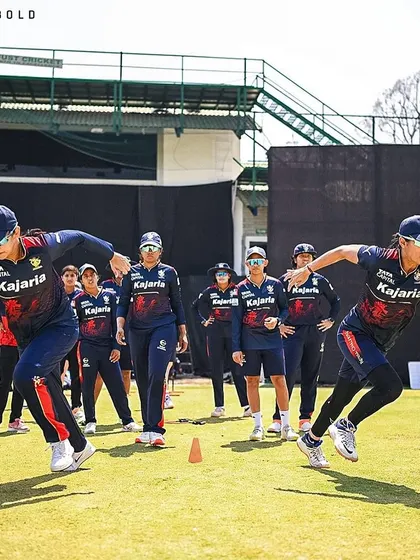 Smriti Mandhana and her RCB teammates during a sprinting drill, showcasing their explosive speed and dedication.