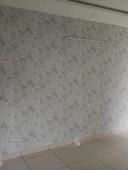 A similar grey textured wallpaper in a different room.