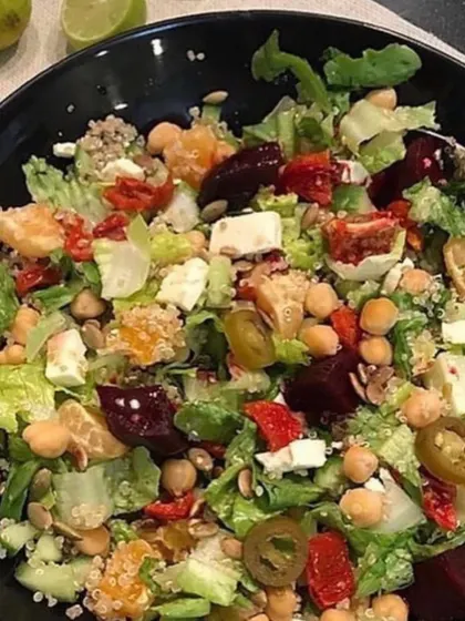This summer salad is loaded with nutrition. It combines lettuce, spinach, paneer, chickpeas, and quinoa with a simple dressing of olive oil and lemon juice. A delightful way to get your nutrients in one bowl.