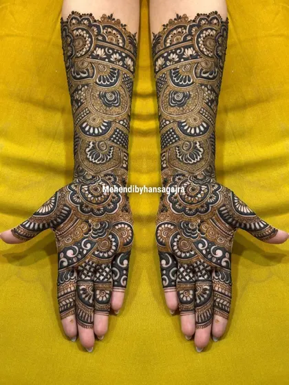 A throwback to one of my earlier designs, showcasing the timeless appeal of intricate, full-coverage mehendi. The bold, dark patterns create a stunning contrast and a truly royal feel.