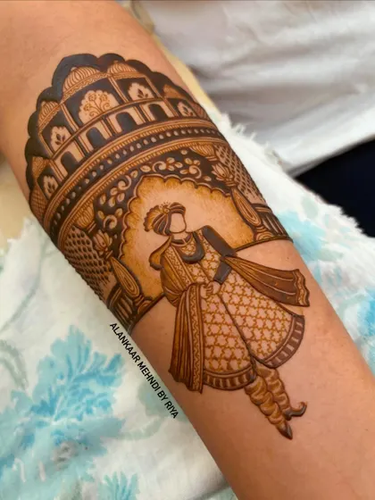 The start of a groom portrait, showing the groom in his royal wedding attire against an architectural backdrop.