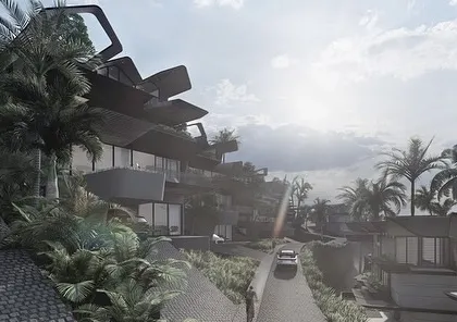 A view up the winding road of the Dona Paula Masterplan. The dynamic, angular forms of the homes are designed to blend with the mountainous site, creating a dramatic architectural journey towards the sea.
