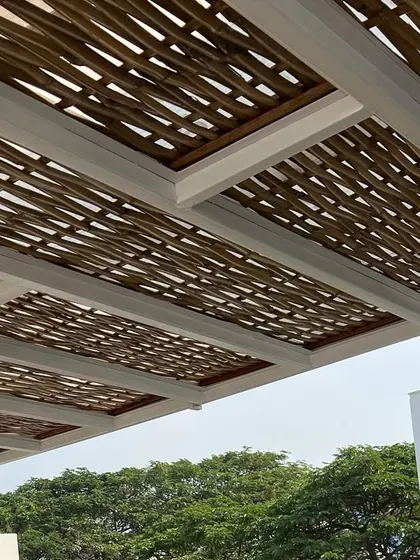 Another look at the woven bamboo ceiling. The natural material and intricate pattern create a stunning visual effect, especially with the modern black light fixtures we installed.