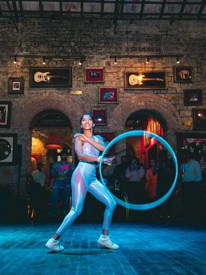 A full-stage view of my performance at the hoop party. The lights, the music, the crowd, it all comes together to create an unforgettable night of flow.