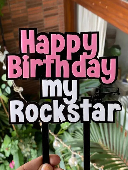 The details of the "Rockstar" topper, including the tiny helicopter accent. We love adding small, personalized touches to our designs.