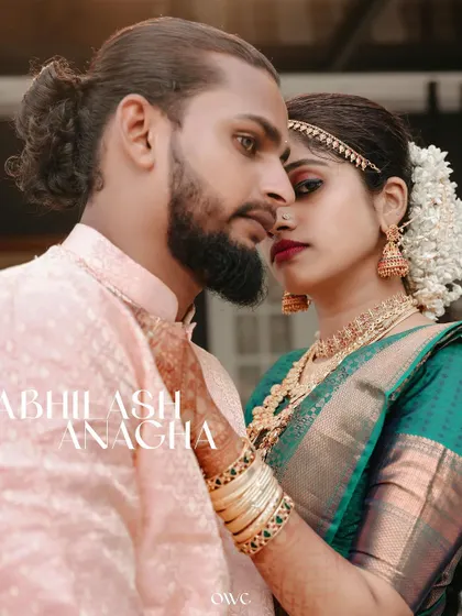 A powerful and intimate portrait of a Kerala couple, their names elegantly displayed, capturing the intensity and beauty of their wedding day.