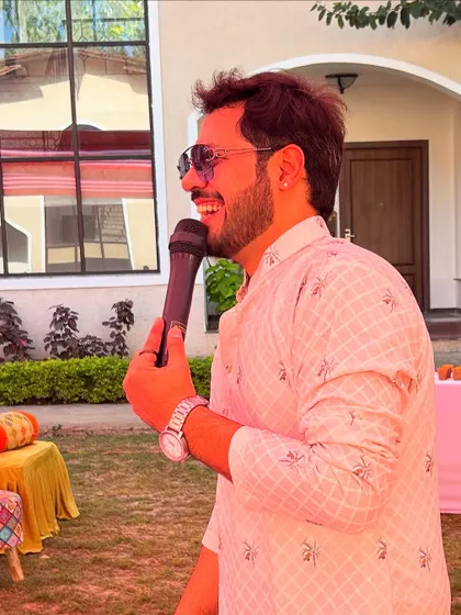 Another happy, candid shot of me holding the microphone, ready for the next fun segment of the event.