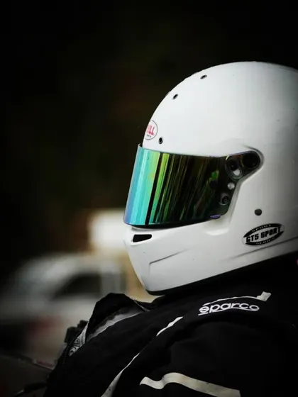 A close up of a driver's helmet.