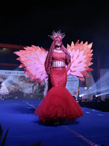 Another view of the stunning red winged costume, showcasing its full dramatic effect on the stage.