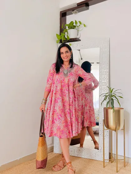 A beautiful pink printed cotton dress from Myntra. This is a perfect summer dress for a casual day out or a vacation.