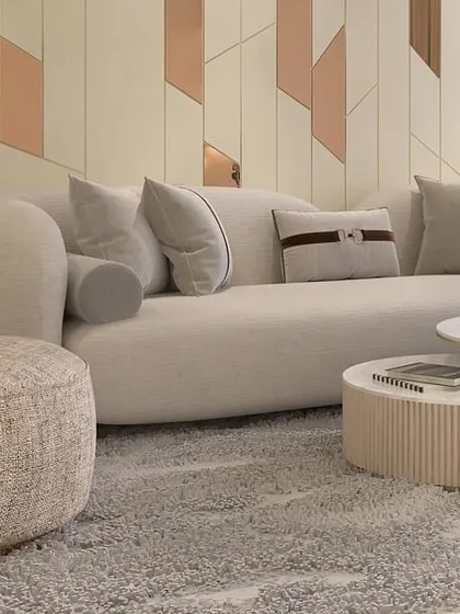 This living room furniture was customized for a site in Dwarka, New Delhi. The curved sofa and swivel armchair, upholstered in organic-feel fabrics, bring a sense of quiet luxury to the space.