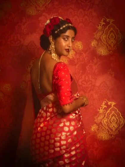 A back profile shot showing the intricate blouse design and the floral hair arrangement I created for Ketaki Narayan's festive look.