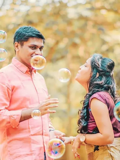 A fun and interactive moment during the couple's outdoor shoot. These are the memories that truly reflect your personality as a couple.