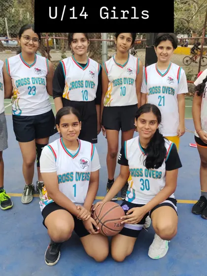 Here is our U-14 girls team, ready for practice. They are focused on developing their skills in passing, shooting, and teamwork.
