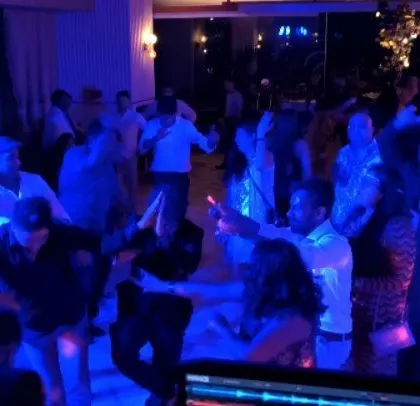 Blue lighting sets the mood as employees dance the night away.