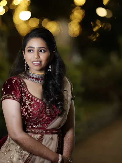A candid shot of Varsha at her reception. The makeup was designed to look beautiful both in person and in photographs, with a focus on glowing skin.