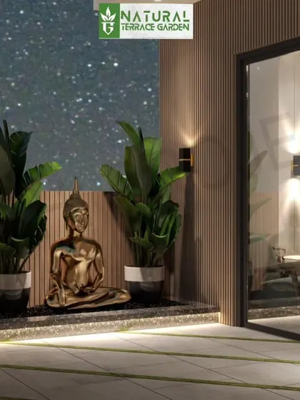 A tranquil corner in a proposed terrace design. A golden Buddha statue is placed among lush plants, creating a peaceful meditation spot next to the glass doors of the living area.