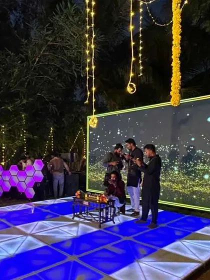 Another view of the beautiful stage setup, ready for an evening of entertainment. The right decor and lighting can completely transform a venue.