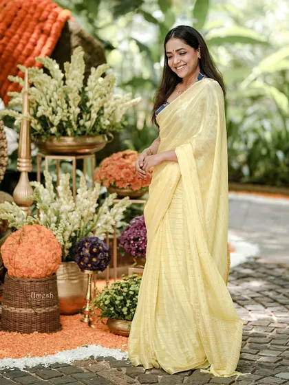 This full-length shot shows the beautiful drape and flow of the lightweight yellow saree. It’s easy to move in and looks stunning from every angle.