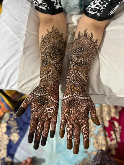 Another angle of this stunning engagement henna, showcasing the detailed patterns on both the front and back of the hands.