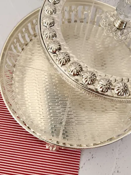 A top-down view highlighting the textured base and floral-engraved rim of the lid. Every detail is crafted to create a sense of luxury.
