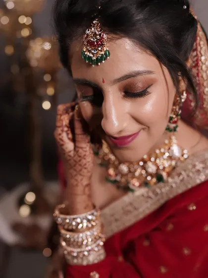 A detailed shot of the bride's reception makeup. You can see the careful blending of the brown smokey eyeshadow and how it makes her eyes stand out.