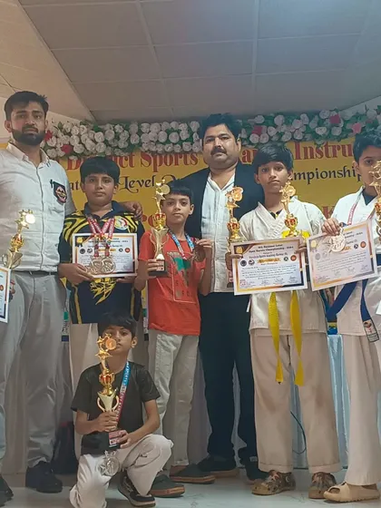 Our team of warriors after a successful campaign at the Karwar open national level championship. A group of our students proudly displaying their medals, certificates, and trophies.