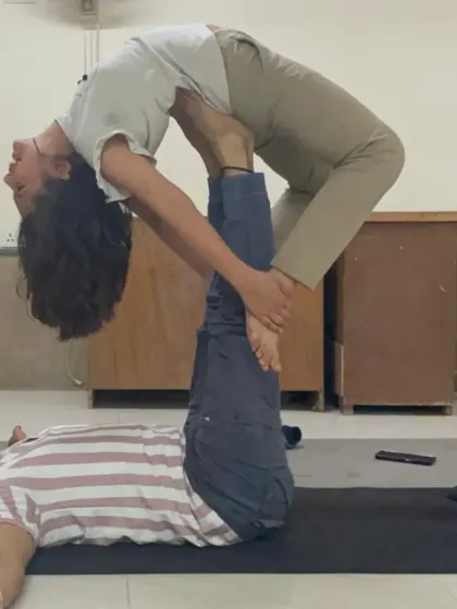 This image captures the trust between the base (me) and the flyer during an Acro Yoga backbend. It's a practice that strengthens both the body and interpersonal connections.