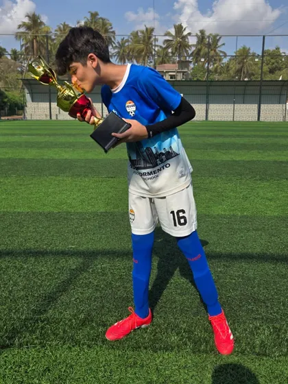 A kiss for the trophy from one of our victorious U14 players.
