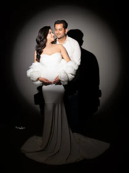 The interaction between a couple during a maternity shoot is so important. This pose, with the dad-to-be embracing his partner, is full of love and support.
