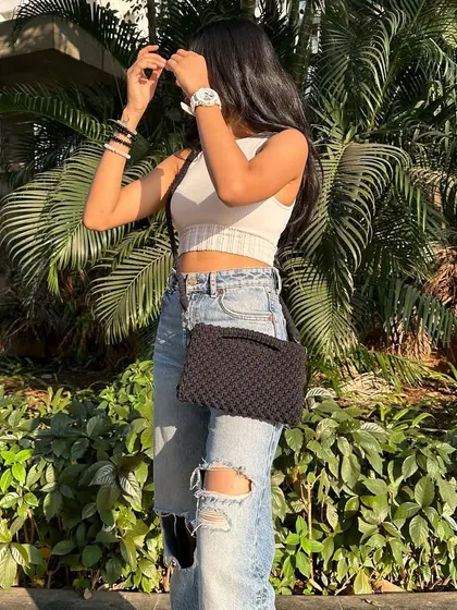 The same bag worn as a cross-body sling. This style is perfect for shopping or exploring, keeping your hands free while your belongings stay secure.