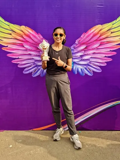 Wings to fly. A post-race photo with my trophy, feeling proud of pushing through and giving my best.
