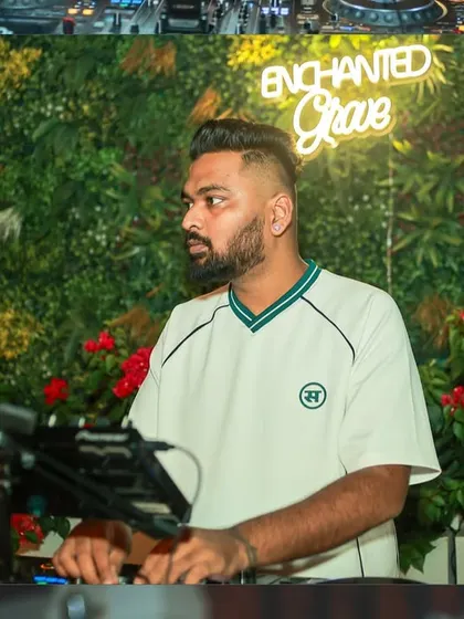 A profile shot of me at the decks. The focus is always on delivering a seamless musical experience.