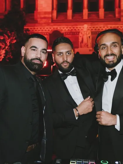 Three of the Kudos DJs behind the decks at the Natural History Museum. We work together as a team to manage the music and energy throughout the night.