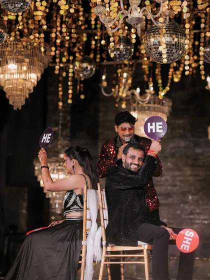 The shoe game in full swing at a sangeet, a fun way to entertain guests and celebrate the couple.